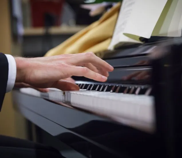 Playing the piano with sheet music